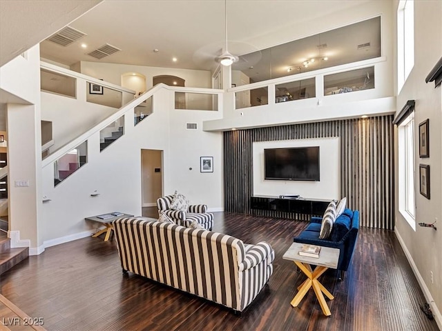 6639 Tranquil Seas Ct, Las Vegas, NV 89139 - living area featuring wood finished floors, stairs, baseboards, a high ceiling, and recessed lighting