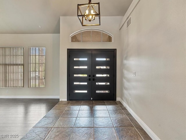6639 Tranquil Seas Ct, Las Vegas, NV 89139 - entryway with a chandelier and baseboards