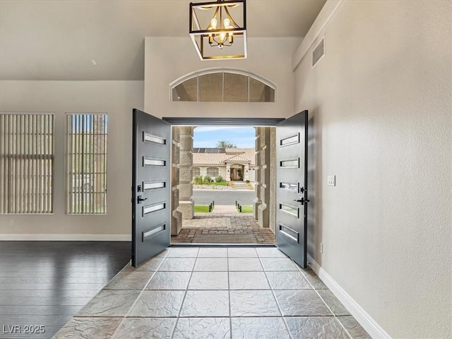 6639 Tranquil Seas Ct, Las Vegas, NV 89139 - foyer entrance with a chandelier, baseboards, and wood finished floors