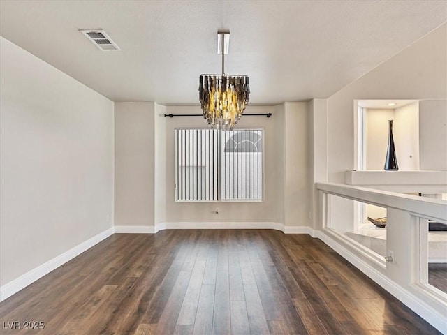 6639 Tranquil Seas Ct, Las Vegas, NV 89139 - unfurnished dining area with a chandelier, dark wood-style floors, and baseboards