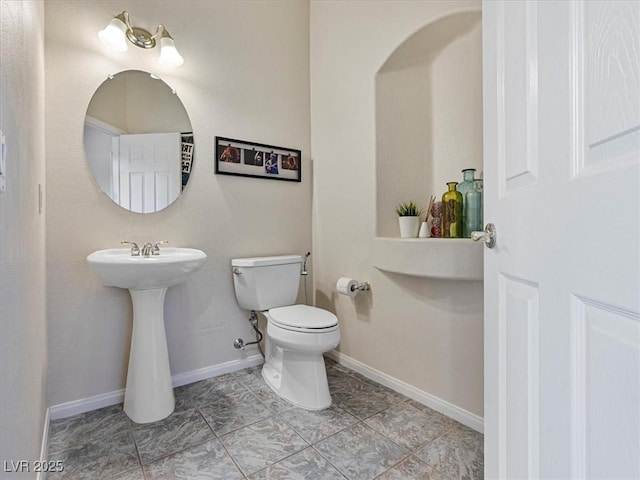 6639 Tranquil Seas Ct, Las Vegas, NV 89139 - half bath featuring toilet and baseboards