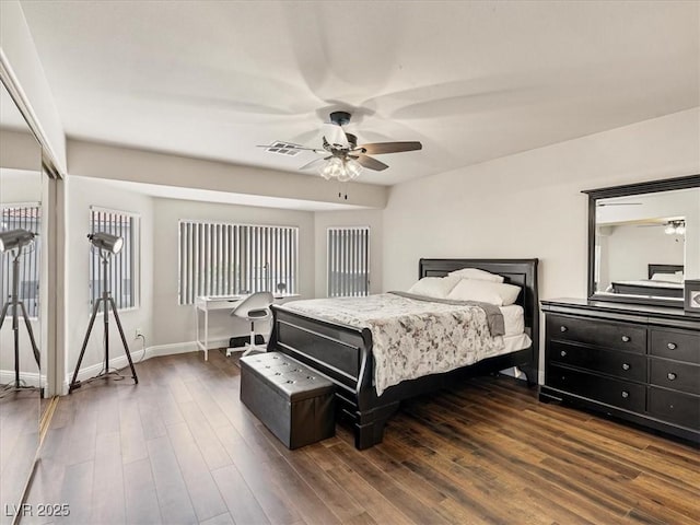 6639 Tranquil Seas Ct, Las Vegas, NV 89139 - bedroom with dark wood-type flooring, baseboards, and a ceiling fan