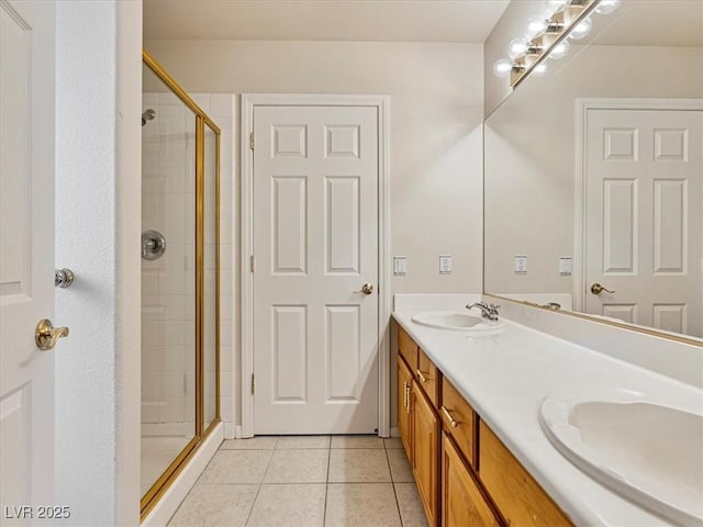 6639 Tranquil Seas Ct, Las Vegas, NV 89139 - bathroom with a stall shower, double vanity, and tile patterned flooring