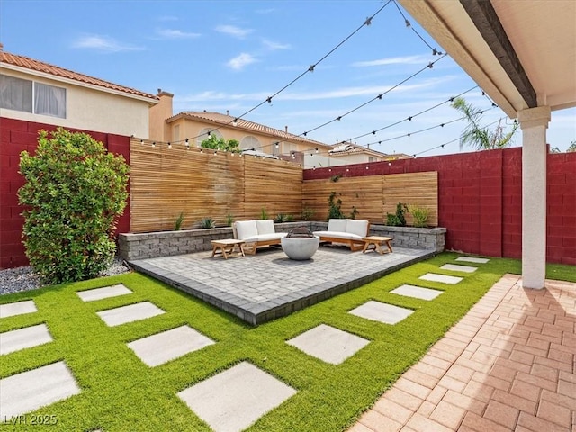 6639 Tranquil Seas Ct, Las Vegas, NV 89139 - view of yard featuring a patio area and an outdoor living space with a fire pit