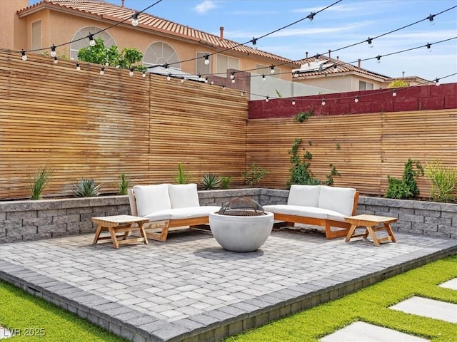 6639 Tranquil Seas Ct, Las Vegas, NV 89139 - view of patio / terrace featuring an outdoor living space with a fire pit