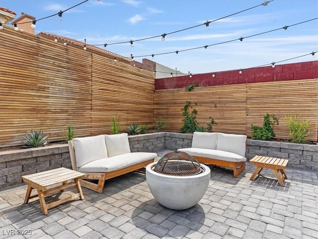 6639 Tranquil Seas Ct, Las Vegas, NV 89139 - fenced backyard with a fire pit and a patio area