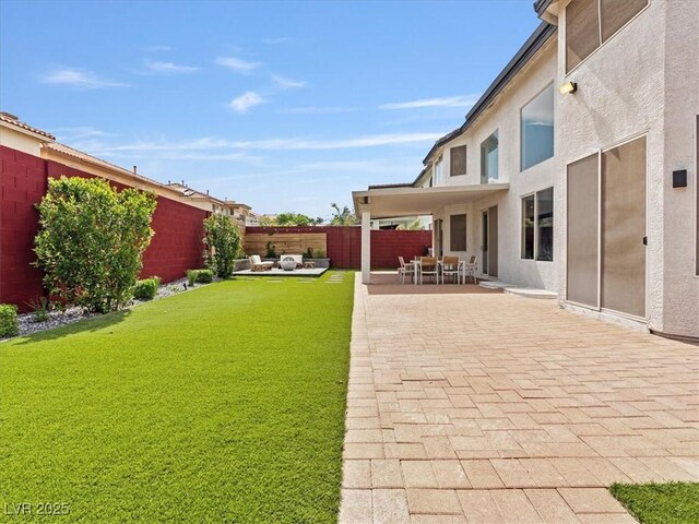 6639 Tranquil Seas Ct, Las Vegas, NV 89139 - view of yard featuring a patio and an outdoor hangout area
