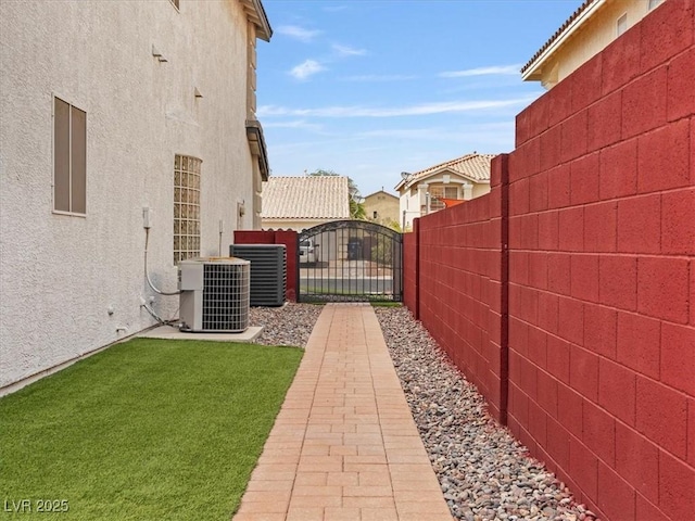 6639 Tranquil Seas Ct, Las Vegas, NV 89139 - view of yard with central AC unit and a gate