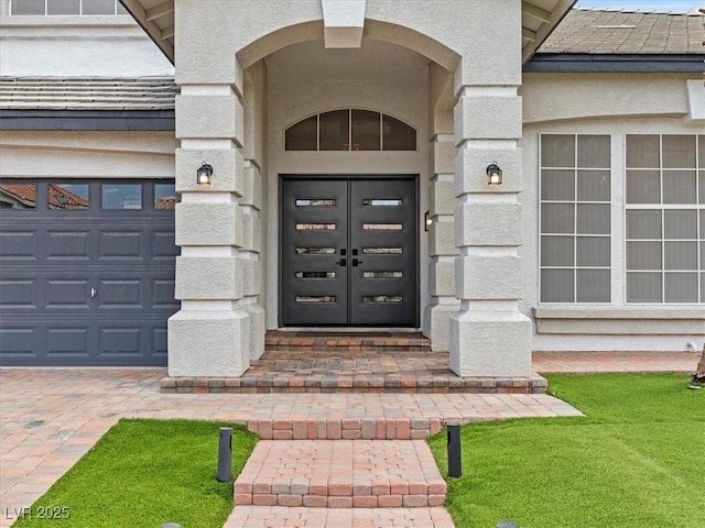 6639 Tranquil Seas Ct, Las Vegas, NV 89139 - property entrance with stucco siding and a garage