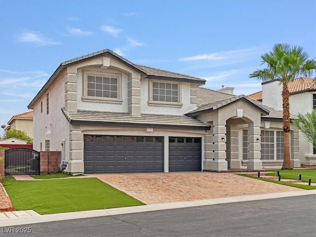 6639 Tranquil Seas Ct, Las Vegas, NV 89139 - view of front of house featuring a tiled roof, stucco siding, a gate, and a garage