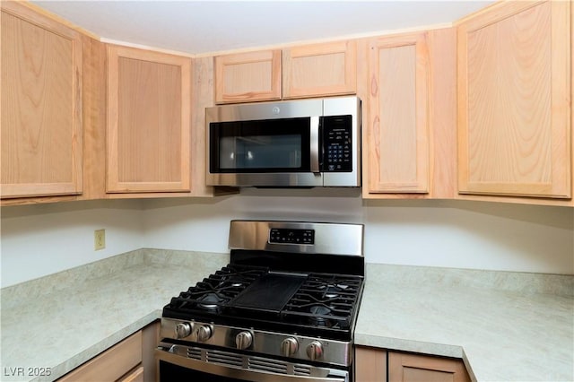 3811 Desert Marina Dr Unit 125, Laughlin, NV 89029 - kitchen featuring appliances with stainless steel finishes, light brown cabinetry, and light countertops