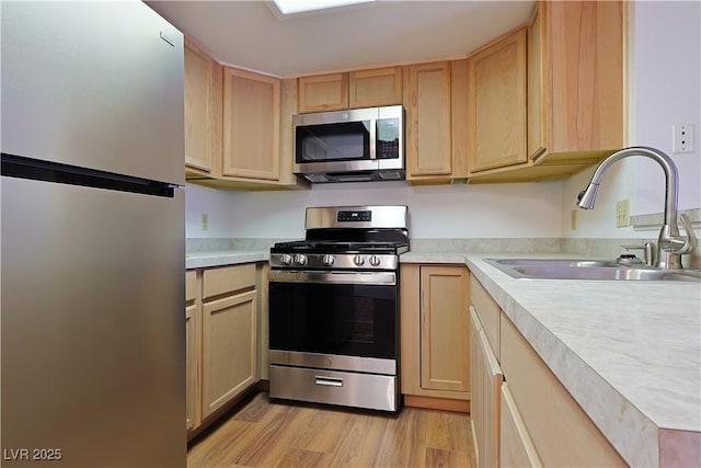 3811 Desert Marina Dr Unit 125, Laughlin, NV 89029 - kitchen featuring stainless steel appliances, a sink, light brown cabinetry, and light countertops