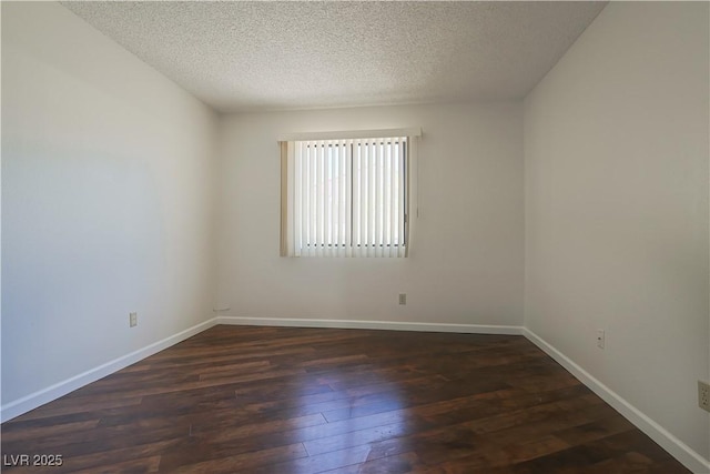 3811 Desert Marina Dr Unit 125, Laughlin, NV 89029 - unfurnished room featuring a textured ceiling, dark wood-type flooring, and baseboards