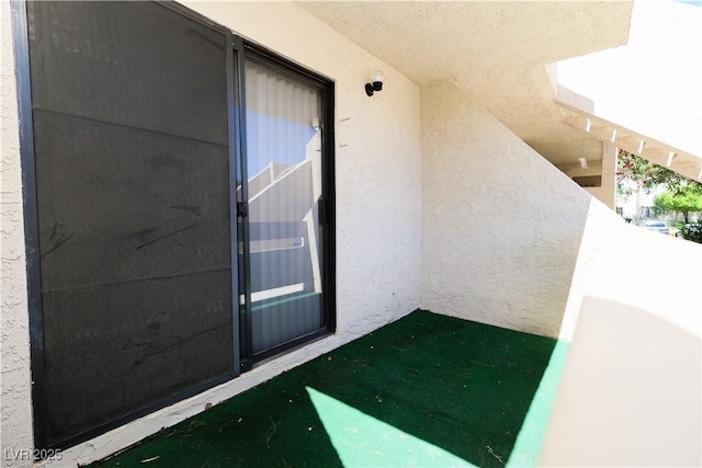 3811 Desert Marina Dr Unit 125, Laughlin, NV 89029 - view of exterior entry featuring a balcony and stucco siding