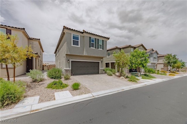 5927 Coja St, Las Vegas, NV 89113 - view of front of property featuring a garage, stucco siding, driveway, and a tiled roof