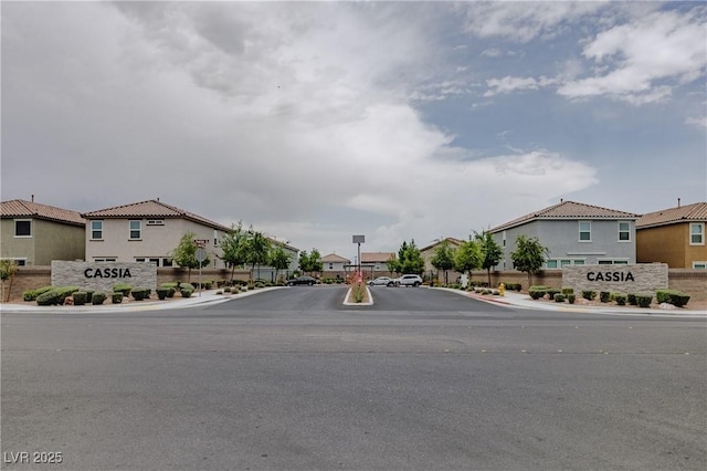 5927 Coja St, Las Vegas, NV 89113 - view of asphalt street featuring sidewalks, a residential view, and curbs