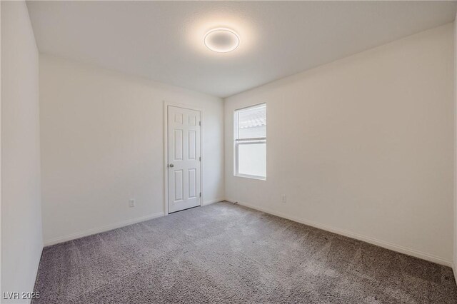 5927 Coja St, Las Vegas, NV 89113 - carpeted empty room with baseboards
