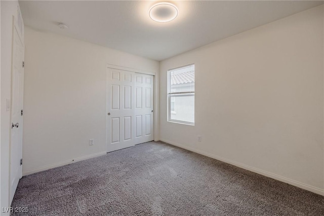 5927 Coja St, Las Vegas, NV 89113 - unfurnished bedroom with carpet, baseboards, and a closet