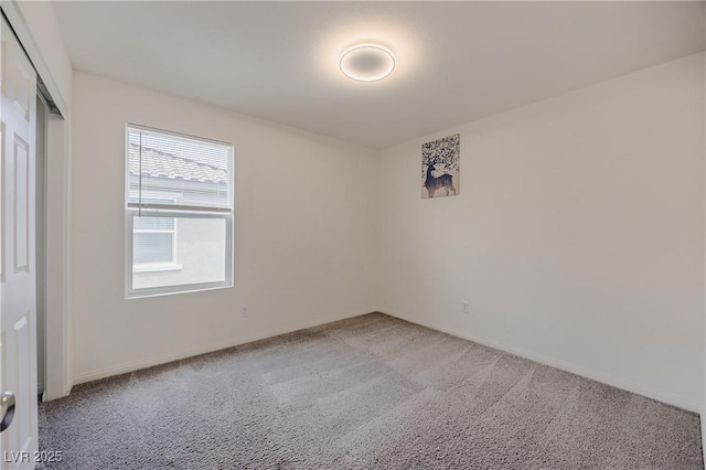 5927 Coja St, Las Vegas, NV 89113 - unfurnished bedroom featuring light carpet, baseboards, and a closet