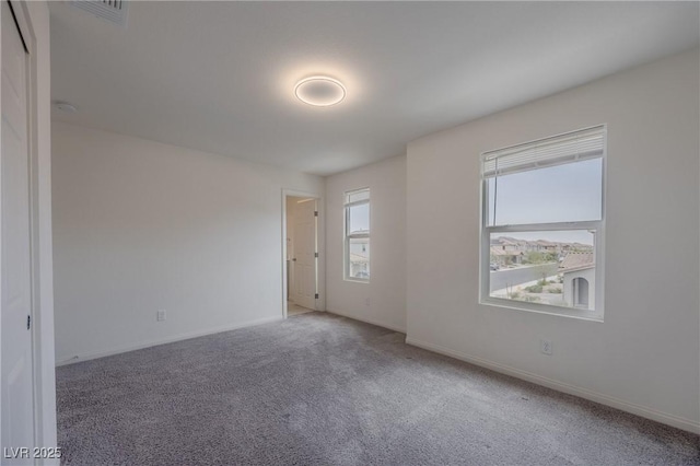 5927 Coja St, Las Vegas, NV 89113 - carpeted spare room with baseboards