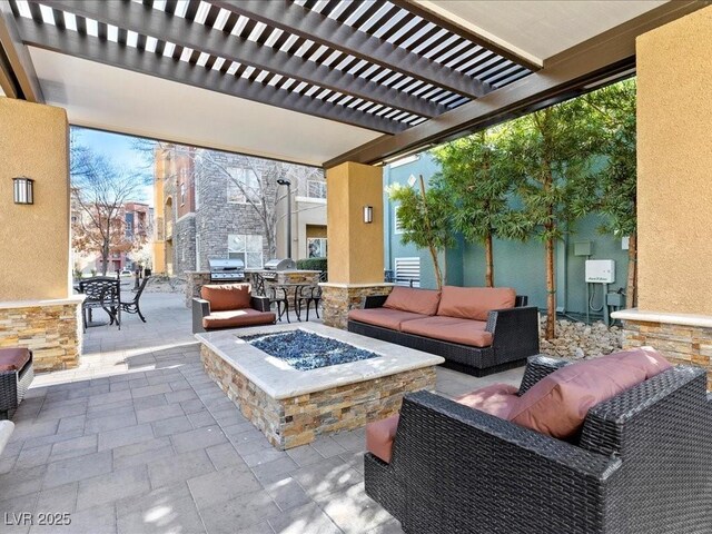 38 E Serene Ave Unit 134, Las Vegas, NV 89123 - view of patio featuring an outdoor living space with a fire pit, an outdoor kitchen, outdoor dining area, and a pergola
