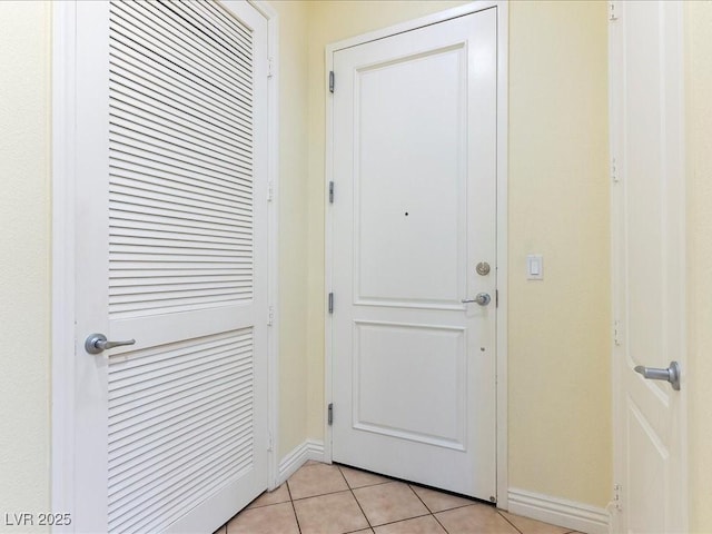 38 E Serene Ave Unit 134, Las Vegas, NV 89123 - doorway to outside featuring baseboards and light tile patterned floors