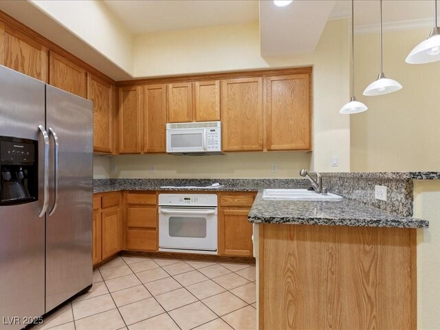 38 E Serene Ave Unit 134, Las Vegas, NV 89123 - kitchen with white appliances, a sink, a peninsula, light tile patterned flooring, and pendant lighting