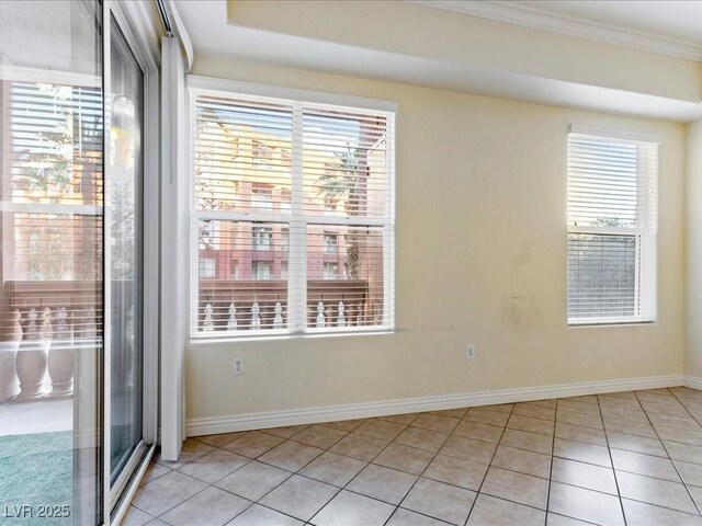 38 E Serene Ave Unit 134, Las Vegas, NV 89123 - empty room with baseboards, healthy amount of natural light, ornamental molding, and light tile patterned floors