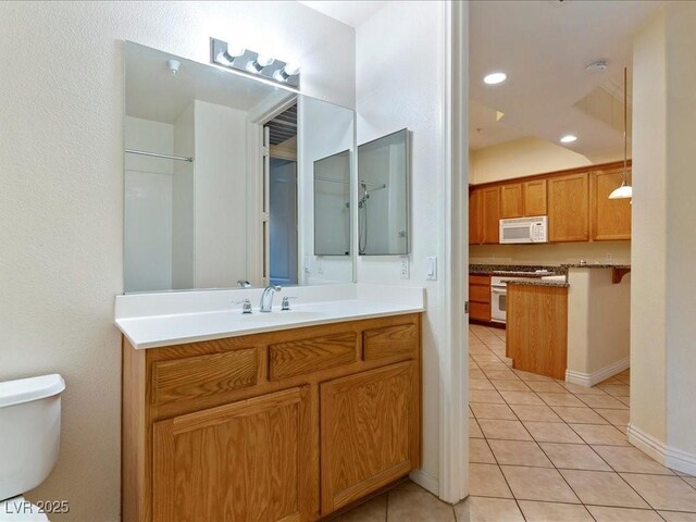 38 E Serene Ave Unit 134, Las Vegas, NV 89123 - bathroom featuring vanity, tile patterned floors, and toilet