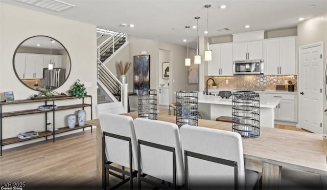 2615 Regency Cove Ct Lot 13, Las Vegas, NV 89121 - living area featuring light wood finished floors, recessed lighting, and stairs