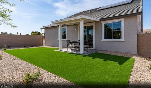 2615 Regency Cove Ct Lot 13, Las Vegas, NV 89121 - back of house featuring stucco siding, roof mounted solar panels, and a patio