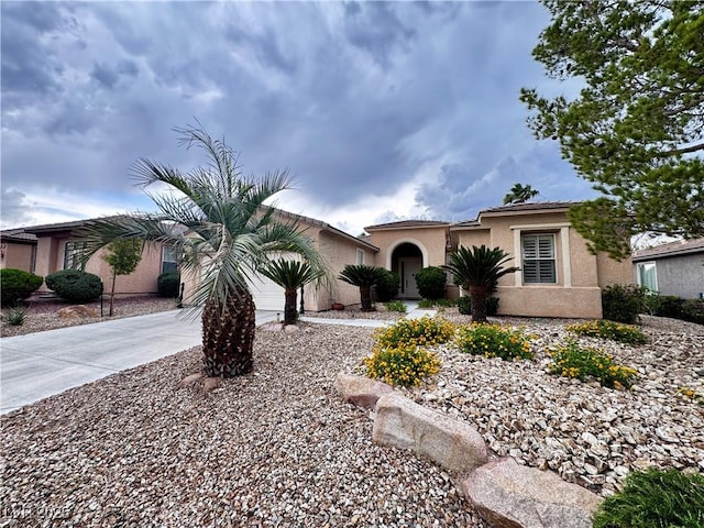10248 Maggira Pl, Las Vegas, NV 89135 - view of front facade featuring stucco siding and concrete driveway