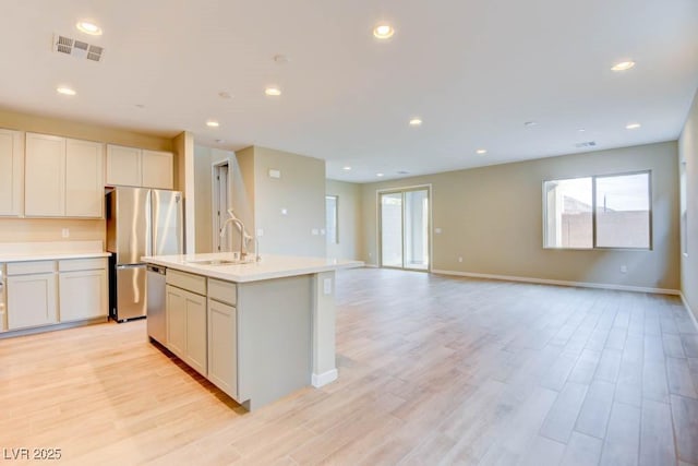 11840 Pelican Butte Ave, Las Vegas, NV 89138 - kitchen featuring appliances with stainless steel finishes, a sink, baseboards, light wood-style flooring, and recessed lighting