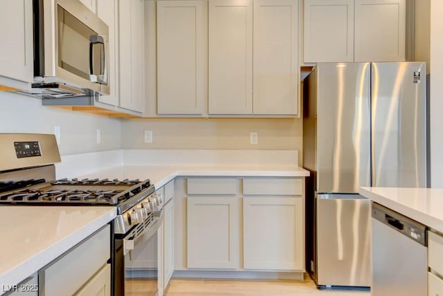 11840 Pelican Butte Ave, Las Vegas, NV 89138 - kitchen featuring appliances with stainless steel finishes and light countertops