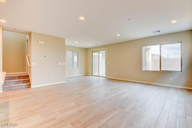 11840 Pelican Butte Ave, Las Vegas, NV 89138 - unfurnished room with light wood-style floors, baseboards, stairway, and recessed lighting