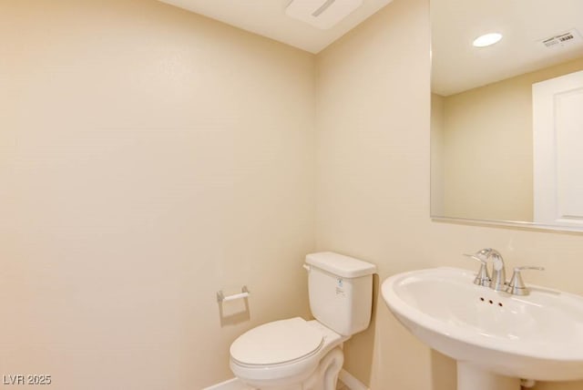 11840 Pelican Butte Ave, Las Vegas, NV 89138 - bathroom featuring baseboards, a sink, and toilet
