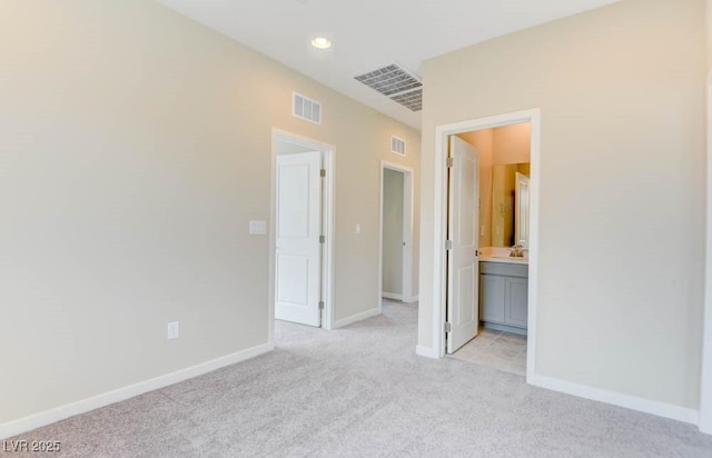 11840 Pelican Butte Ave, Las Vegas, NV 89138 - unfurnished bedroom with light colored carpet, baseboards, connected bathroom, and recessed lighting