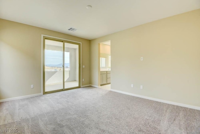 11840 Pelican Butte Ave, Las Vegas, NV 89138 - empty room with light colored carpet and baseboards
