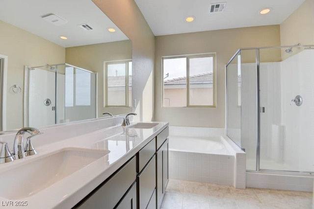 11840 Pelican Butte Ave, Las Vegas, NV 89138 - full bathroom featuring a stall shower, a garden tub, double vanity, recessed lighting, and tile patterned floors