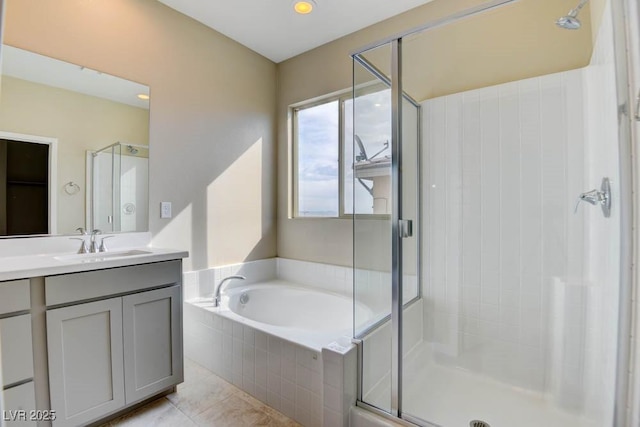 11840 Pelican Butte Ave, Las Vegas, NV 89138 - full bath featuring vanity, a stall shower, a garden tub, and tile patterned floors