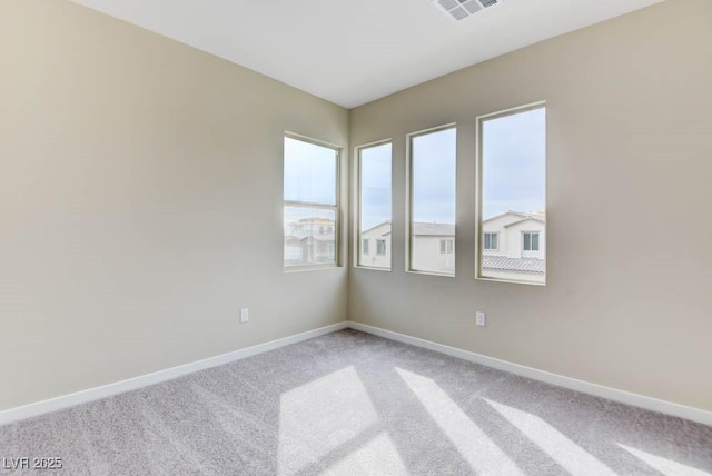 11840 Pelican Butte Ave, Las Vegas, NV 89138 - unfurnished room featuring healthy amount of natural light, light carpet, and baseboards
