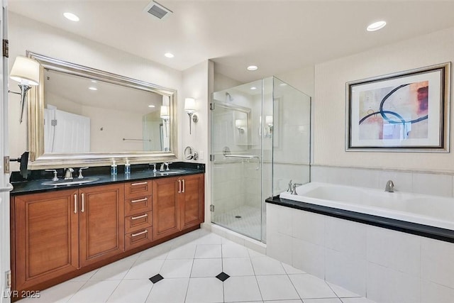 135 E Harmon Ave Unit 1403, Las Vegas, NV 89109 - full bathroom with a shower stall, a bath, double vanity, tile patterned flooring, and recessed lighting