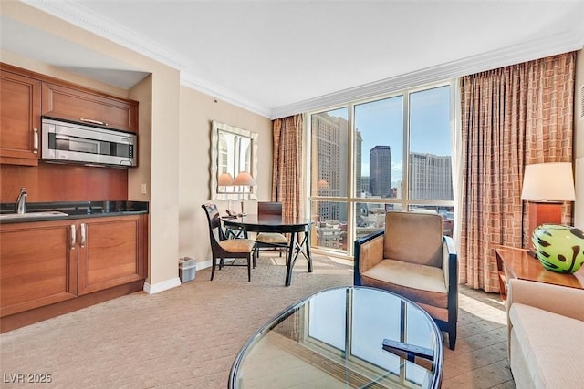135 E Harmon Ave Unit 1403, Las Vegas, NV 89109 - living room with baseboards, ornamental molding, a skyline view, light colored carpet, and floor to ceiling windows