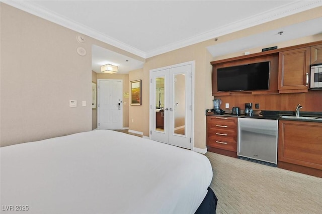135 E Harmon Ave Unit 1403, Las Vegas, NV 89109 - bedroom with french doors, a sink, refrigerator, ornamental molding, and baseboards