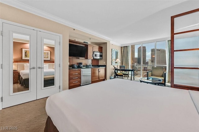 135 E Harmon Ave Unit 1403, Las Vegas, NV 89109 - carpeted bedroom featuring french doors, ornamental molding, a sink, and fridge