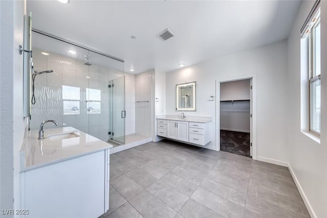 1038 Delbrook Ave, Henderson, NV 89012 - bathroom featuring vanity, a stall shower, baseboards, healthy amount of natural light, and recessed lighting