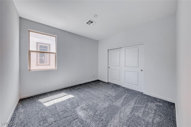 1038 Delbrook Ave, Henderson, NV 89012 - unfurnished bedroom with carpet, baseboards, and a closet