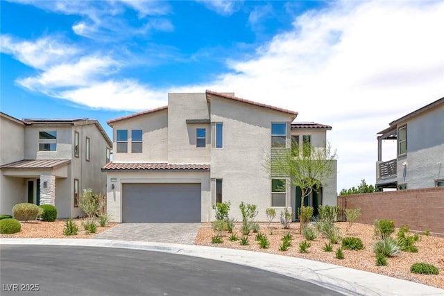 1038 Delbrook Ave, Henderson, NV 89012 - view of front of house with stucco siding, an attached garage, driveway, and a tile roof