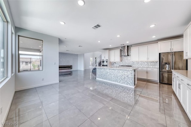 1038 Delbrook Ave, Henderson, NV 89012 - kitchen with stainless steel appliances, tasteful backsplash, light countertops, white cabinetry, and a sink