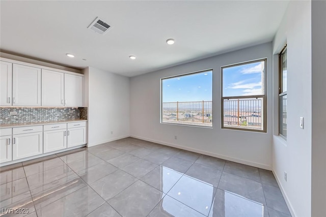 1038 Delbrook Ave, Henderson, NV 89012 - unfurnished room with light tile patterned flooring, recessed lighting, and baseboards
